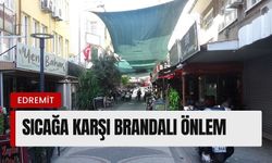 Edremit'te sıcaktan bunalan esnaf çareyi zeytin brandasında buldu