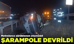 Metrelerce sürüklenen otomobil şarampole devrildi