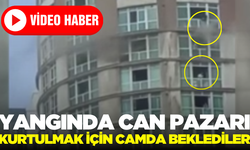 Çıkan yangında kurtarılmak için camda beklediler!