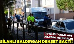 Silahlı saldırgan 2 polis memurunu yaralayıp ailesini rehin aldı!