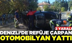 Denizli'de otomobil refüje çarpıp yan yattı: 2 yaralı