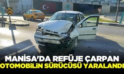 Manisa'da refüje çarpan otomobilin sürücüsü hastaneye kaldırıldı