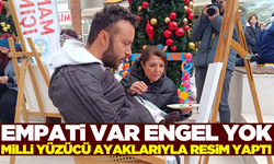 Manisa'da ayakları ile resim yapan milli yüzücü azmi ile örnek oldu