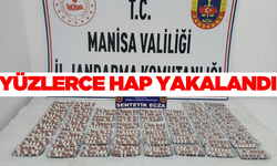 Manisa'da bir araçta yapılan aramada yüzlerce sentetik ecza hapı yakalandı