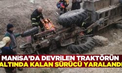 Manisa'da devrilen traktörün altında kalan çiftçi yaralandı