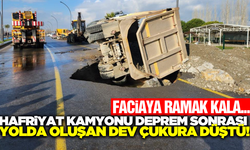 Balıkesir'de hafriyat kamyonu yarılan yolun içine düştü!