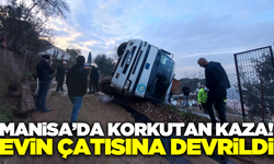 Manisa'da kamyon evin çatısına devrildi