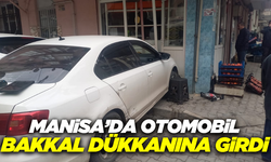 Manisa'da kontrolden çıkan otomobil dükkana çarptı